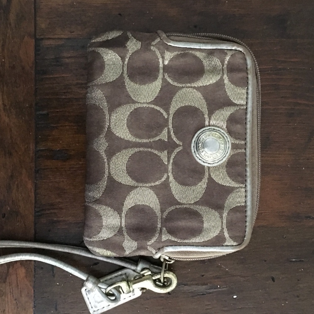 Gold coach wristlet